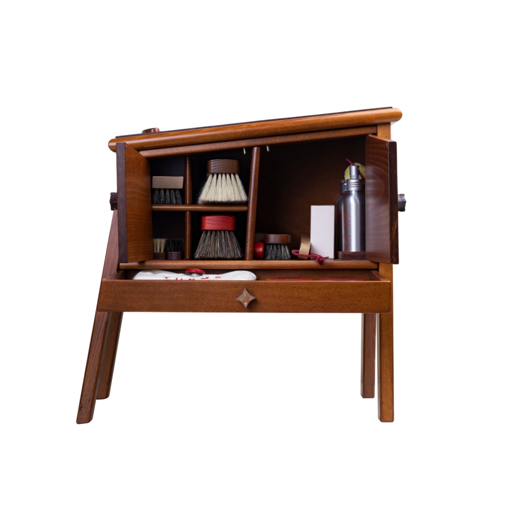 Footstool in brown to store shoe care products with open doors